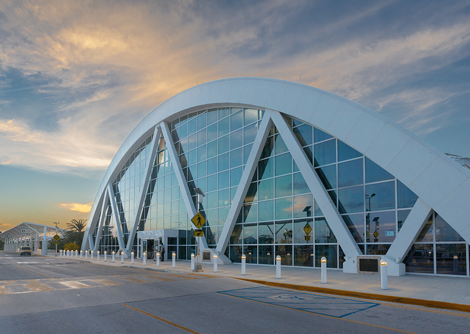 Modern frontage of Owen Roberts International Airport in Grand Cayman.