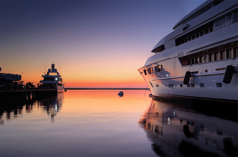 Large Yachts looking out to a Cayman sunset.