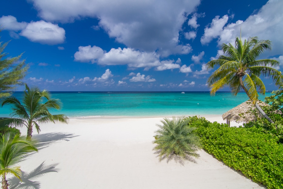 The powder white sands and crystal waters of Seven Mile Beach.