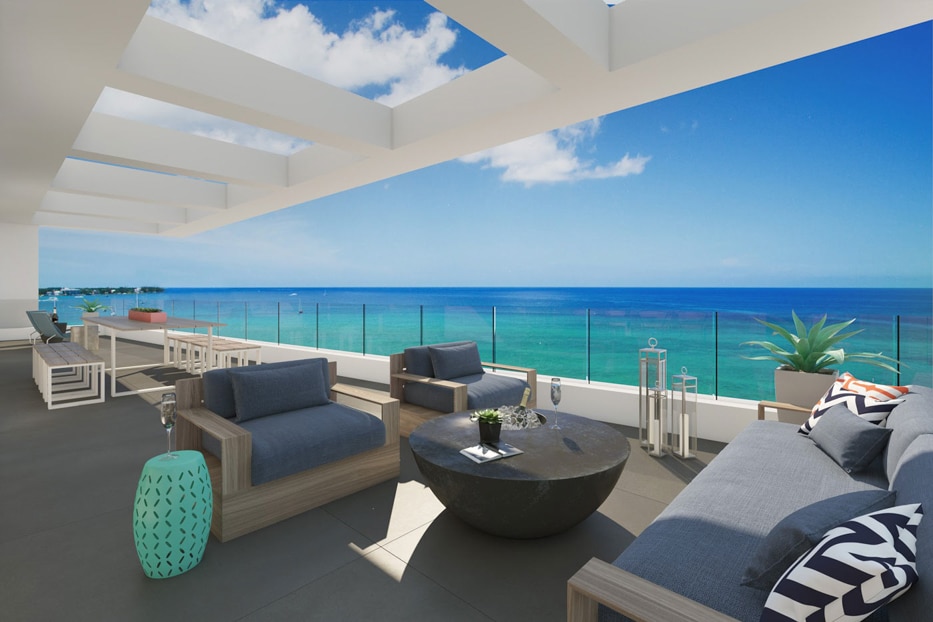 The spacious waterfront terraces of Aqua, Seven Mile Beach.