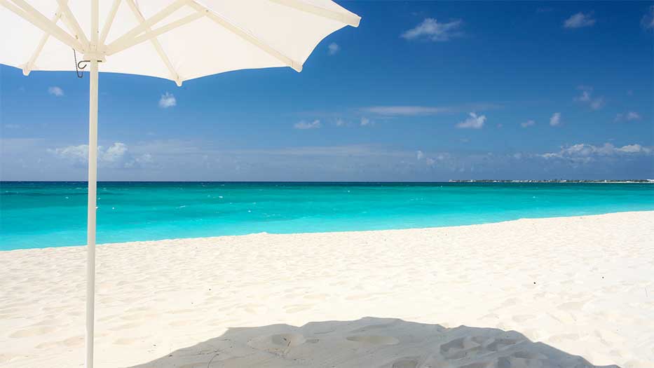 View of the Caribbean Sea from the beach at The Avalon on Seven Mile Beach, Grand Cayman