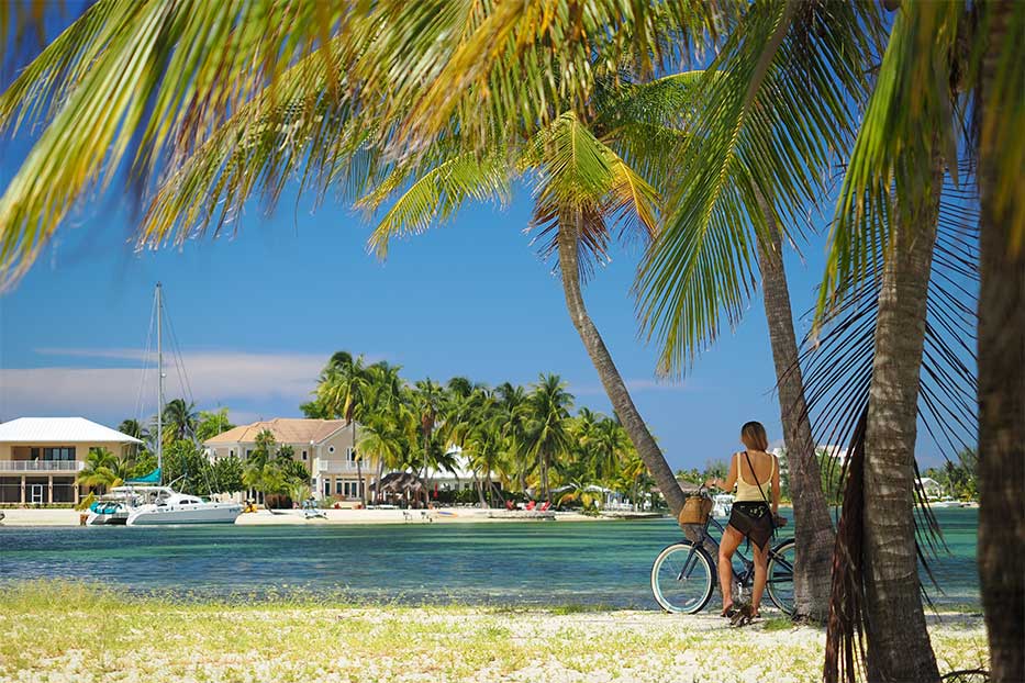 Lady exploring buying Cayman Real Estate in beautiful Rum Point.