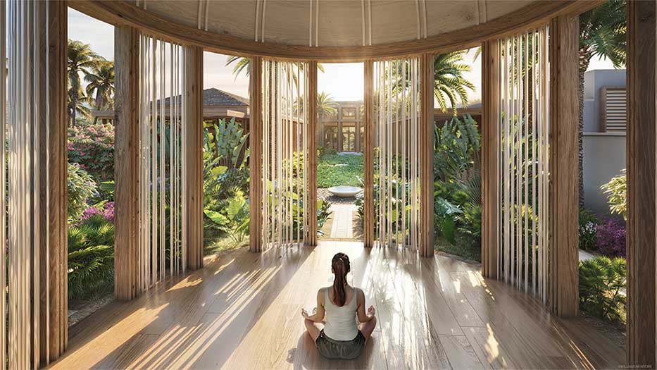 Woman sitting in yoga pose in Spa Pavilion at Mandarin Oriental in Cayman Islands