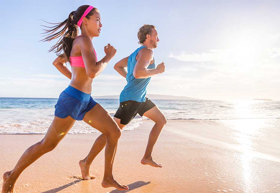 A couple jogging on the beach