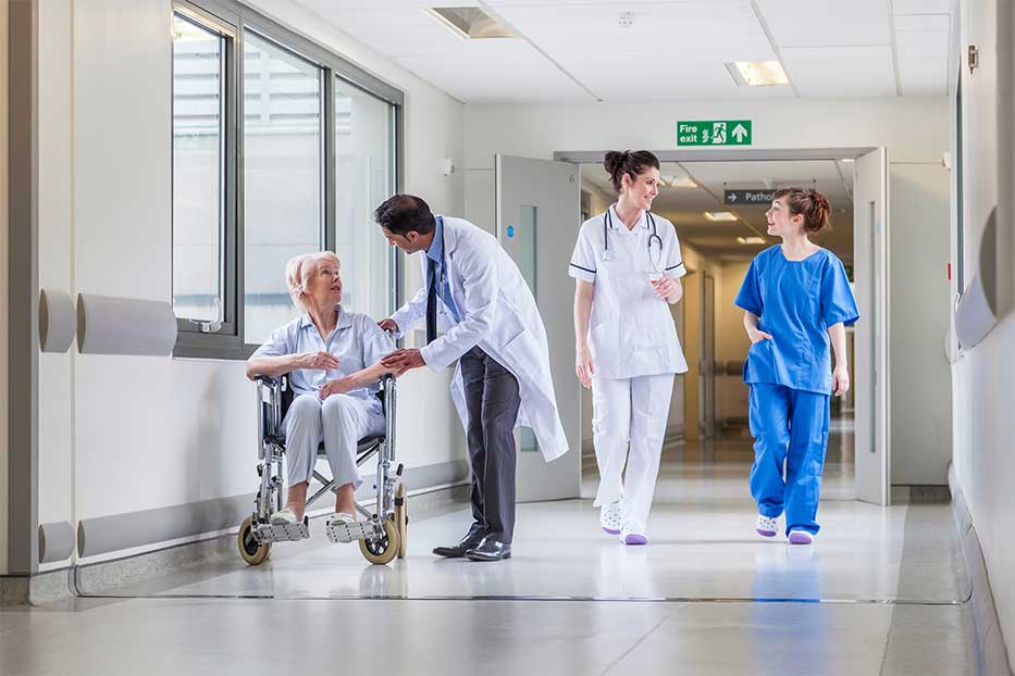 Medical professionals in a hospital corridor