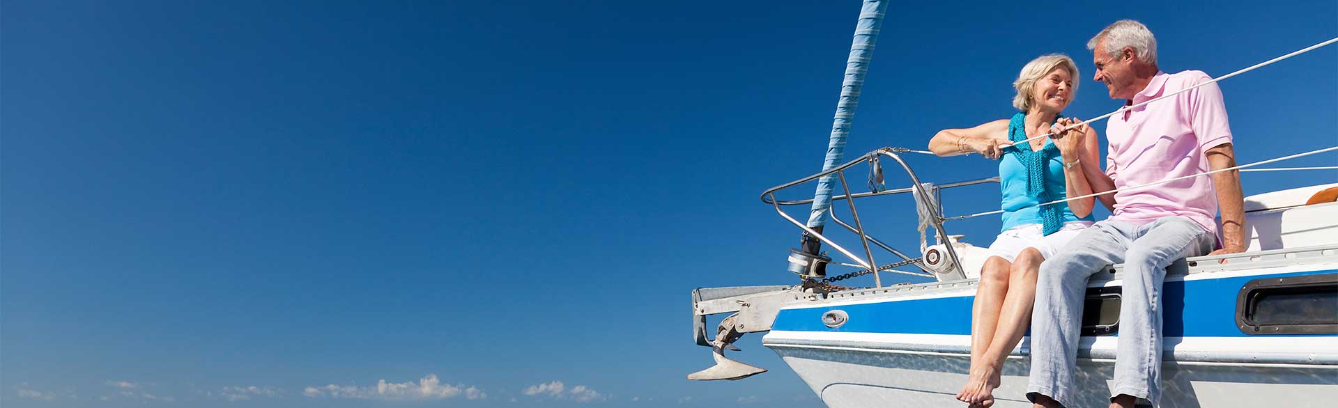 Couple enjoying retirement from a sailing boat on the Caribbean Sea