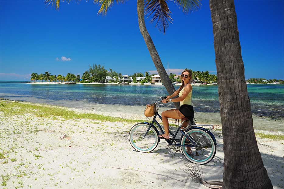 A woman exploring the Cayman Islands by bicycle