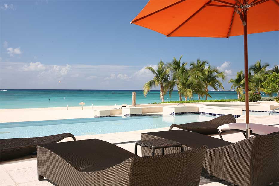 Views from Waters Edge over the swimming pool towards Seven Mile Beach