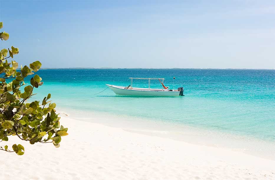Small boat close to shore of the Cayman Islands
