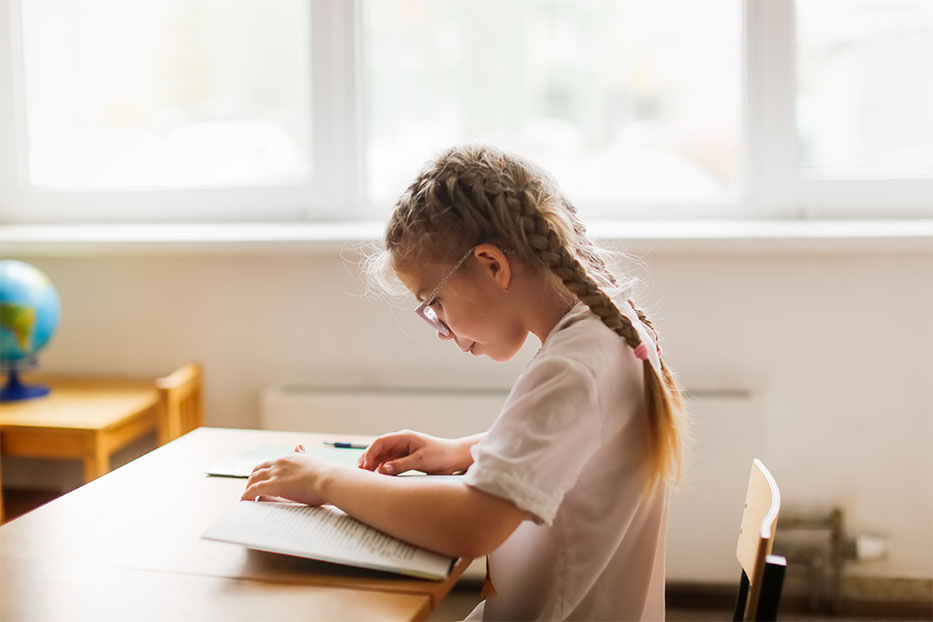 School girl working at a desk