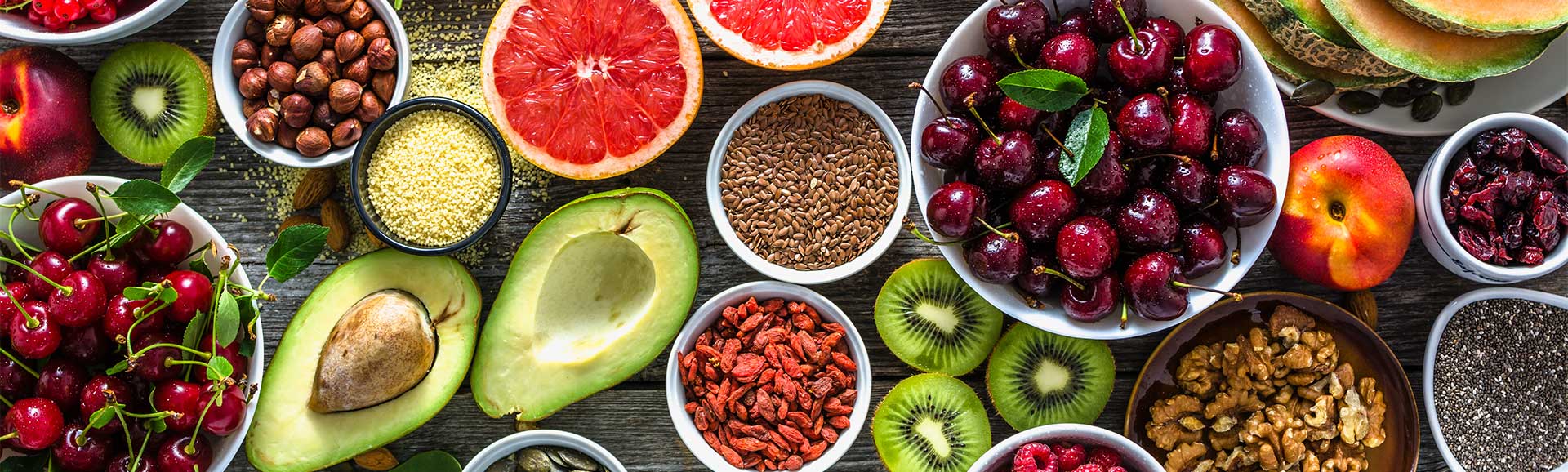 An array of healthy fruit, nuts and vegetables