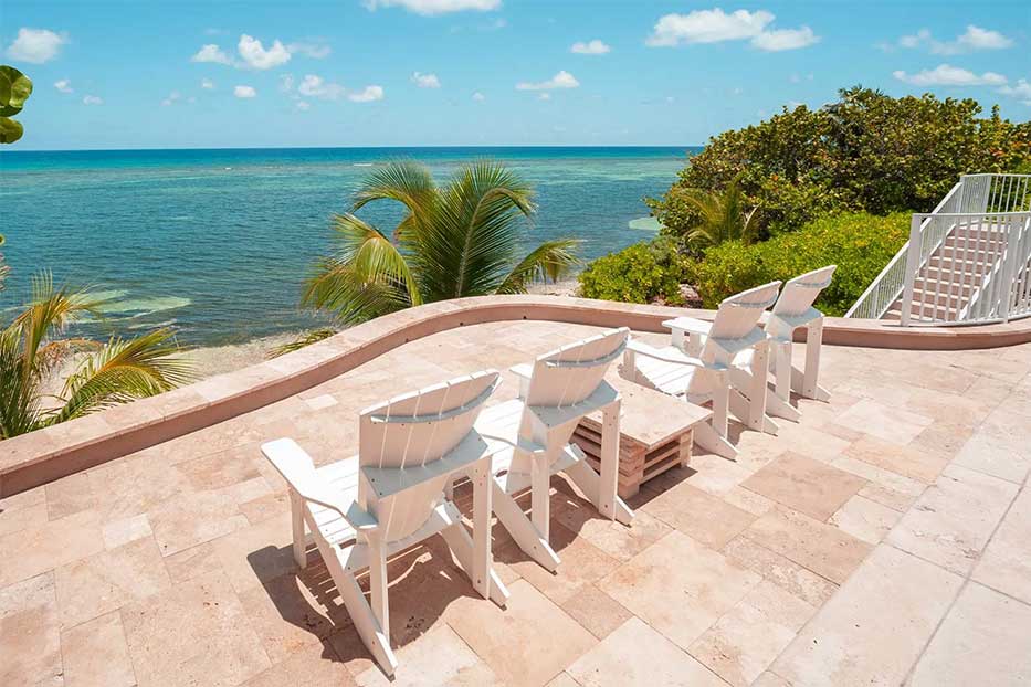 Our Cayman Cottage, perched high on the bluff offers a spectacular panoramic view of the Caribbean Sea. 